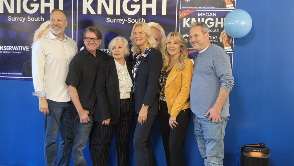 Megan Knight Campaign Launch Draws Strong Local Support in Surrey 3 A group poses in front of Megan Knight campaign signs at the Surrey campaign office.
